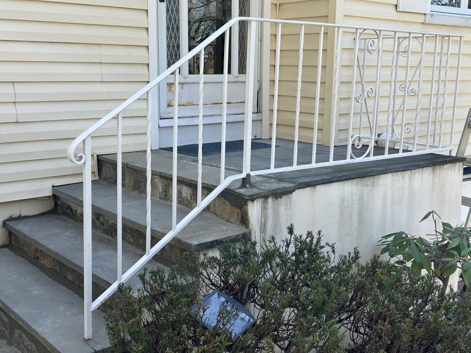 Rebuilt bluestone front steps with fieldstone risers