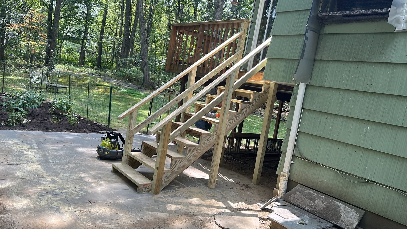 New pressure-treated deck stairs and railings
